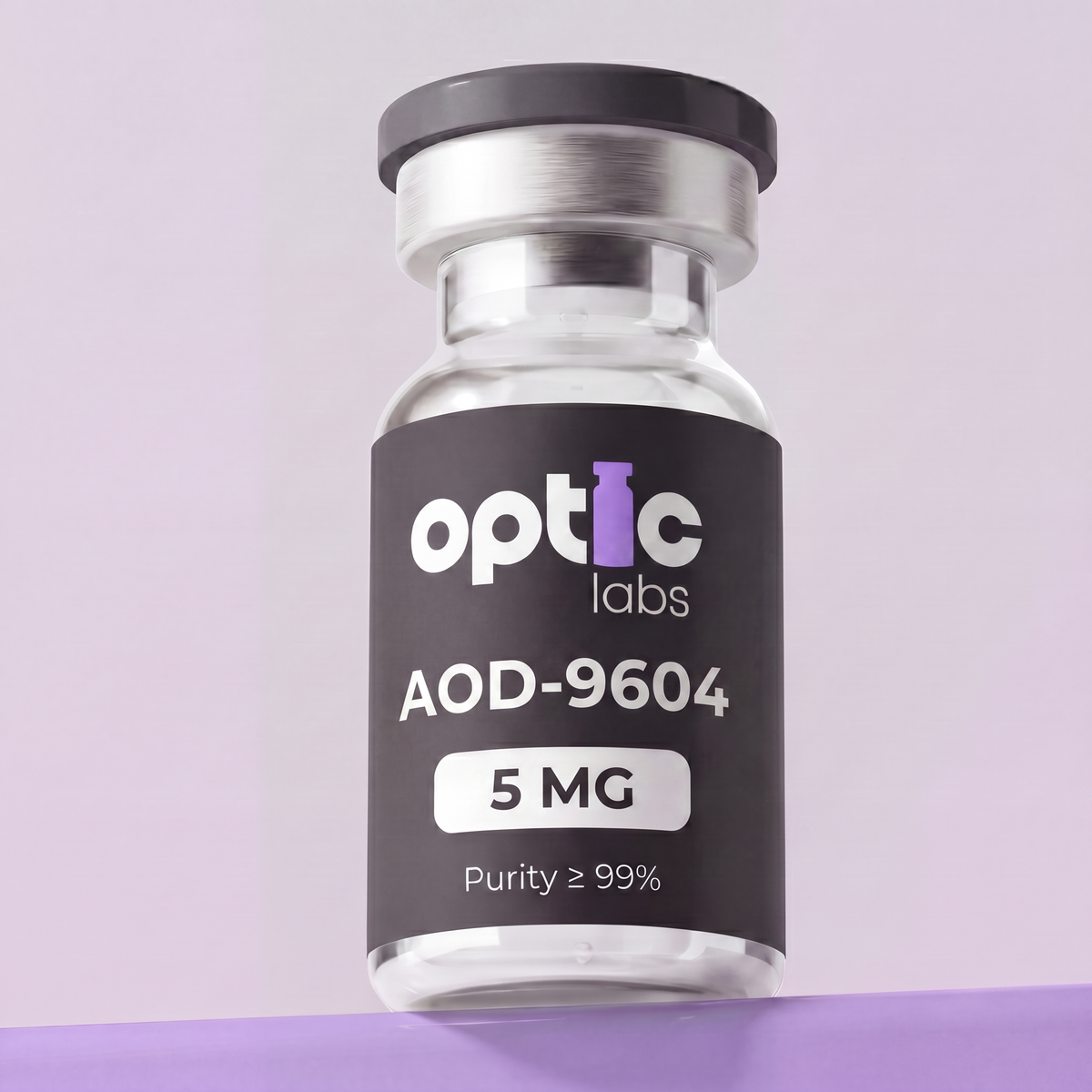 A clear vial with a black label reading Optic Labs AOD-9604 5mg sits against a light purple background. Optic Labs Au